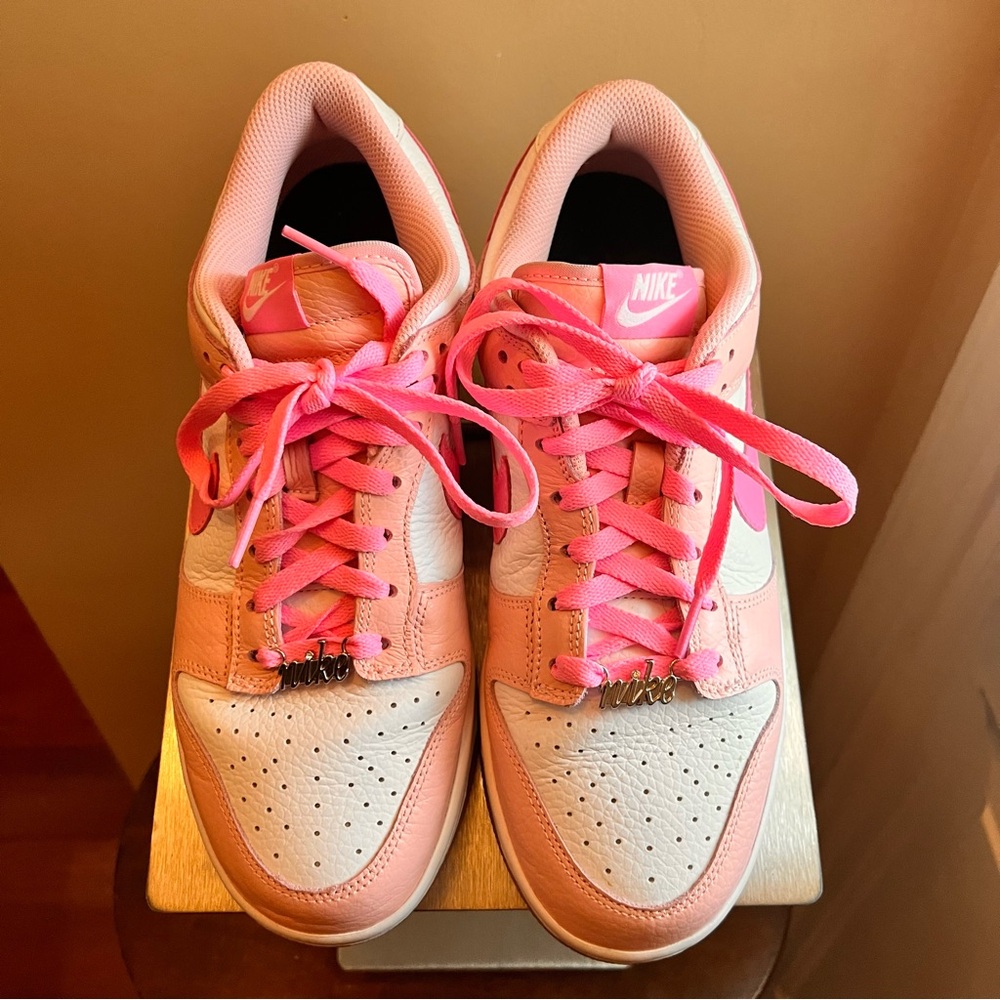 Nike Women's Pink and White Air Force 1 Sneakers.